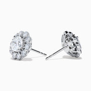 The Star Lab Grown Diamond Fleur Stud Earrings feature a central round diamond with a floral halo of smaller diamonds, beautifully set in 18K white gold for a timeless look.