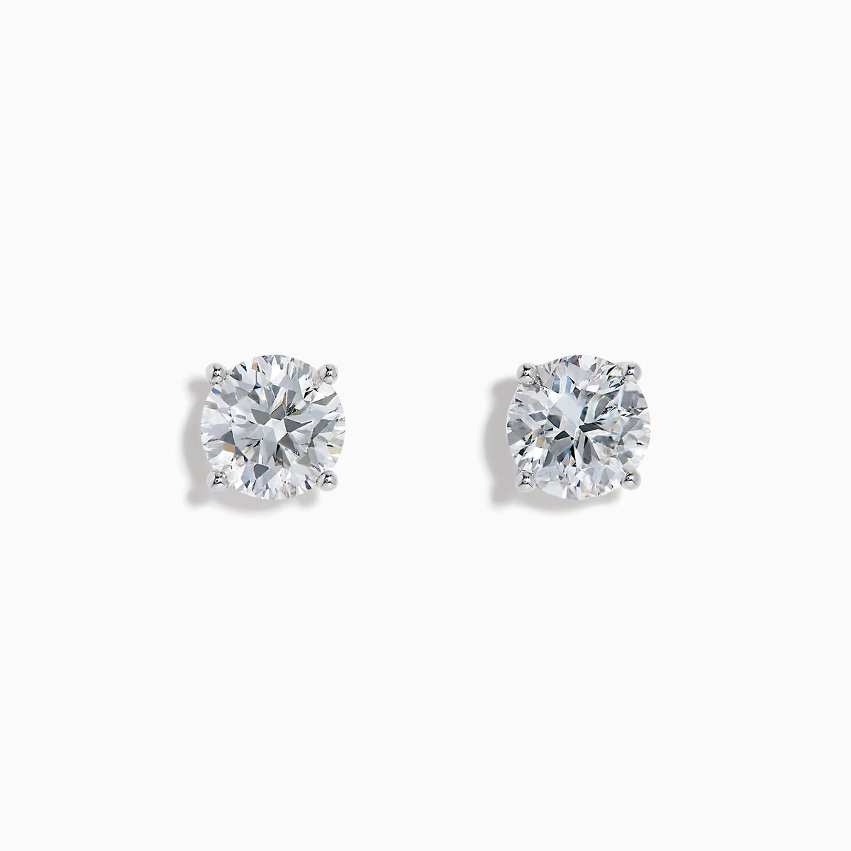 The Star Lab Grown Diamond Stud Earrings feature round, clear lab diamonds set in elegant four-prong 18K white gold settings, shown on a white background.