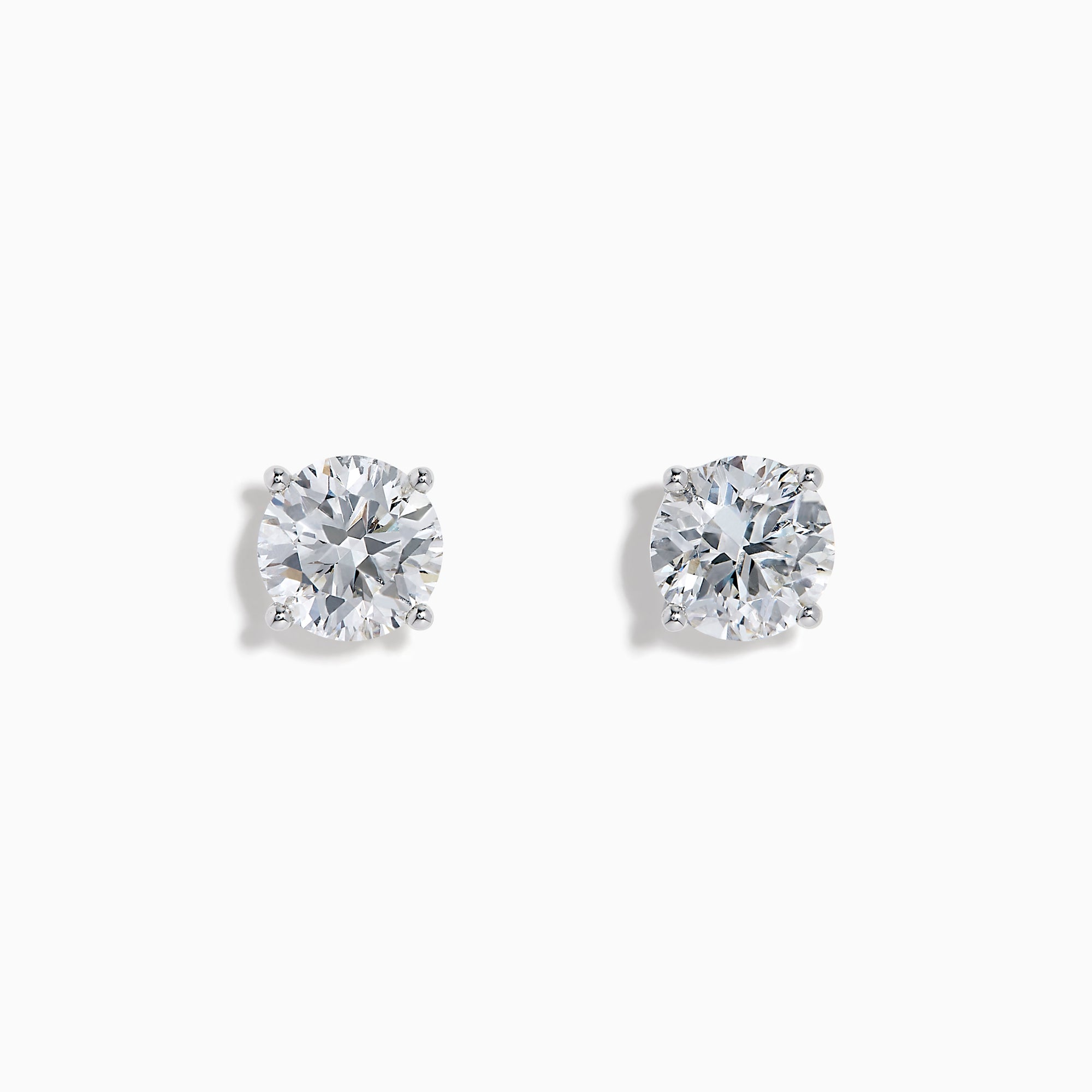 The Star Lab Grown Diamond Stud Earrings feature round, clear lab diamonds set in elegant four-prong 18K white gold settings, shown on a white background.