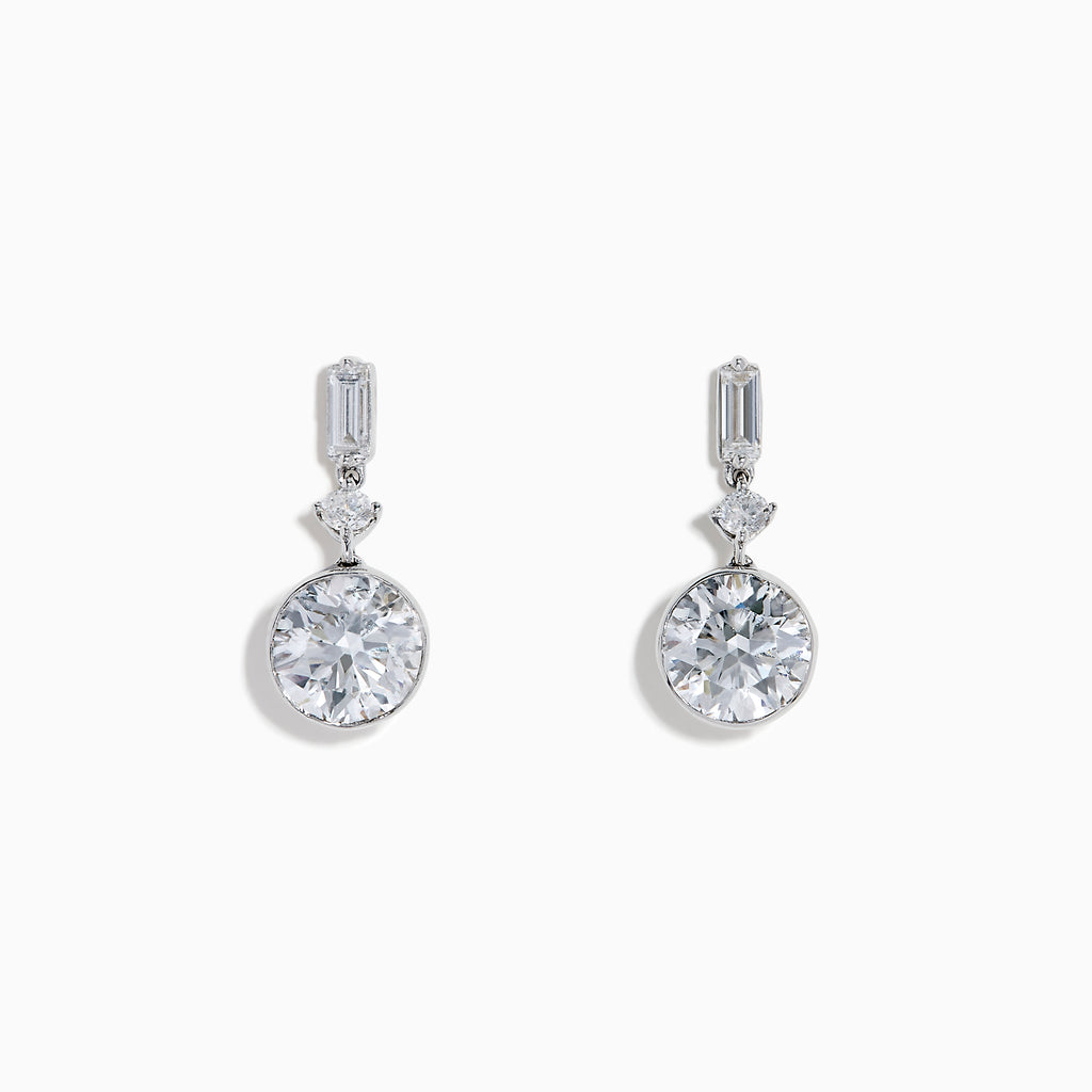 Star Lab Grown Diamond Bezel Solitaire Drop Earrings in 18K White Gold feature a round diamond at the bottom, a marquise-shaped diamond in the middle, and a rectangular diamond at the top, all set against a white background.