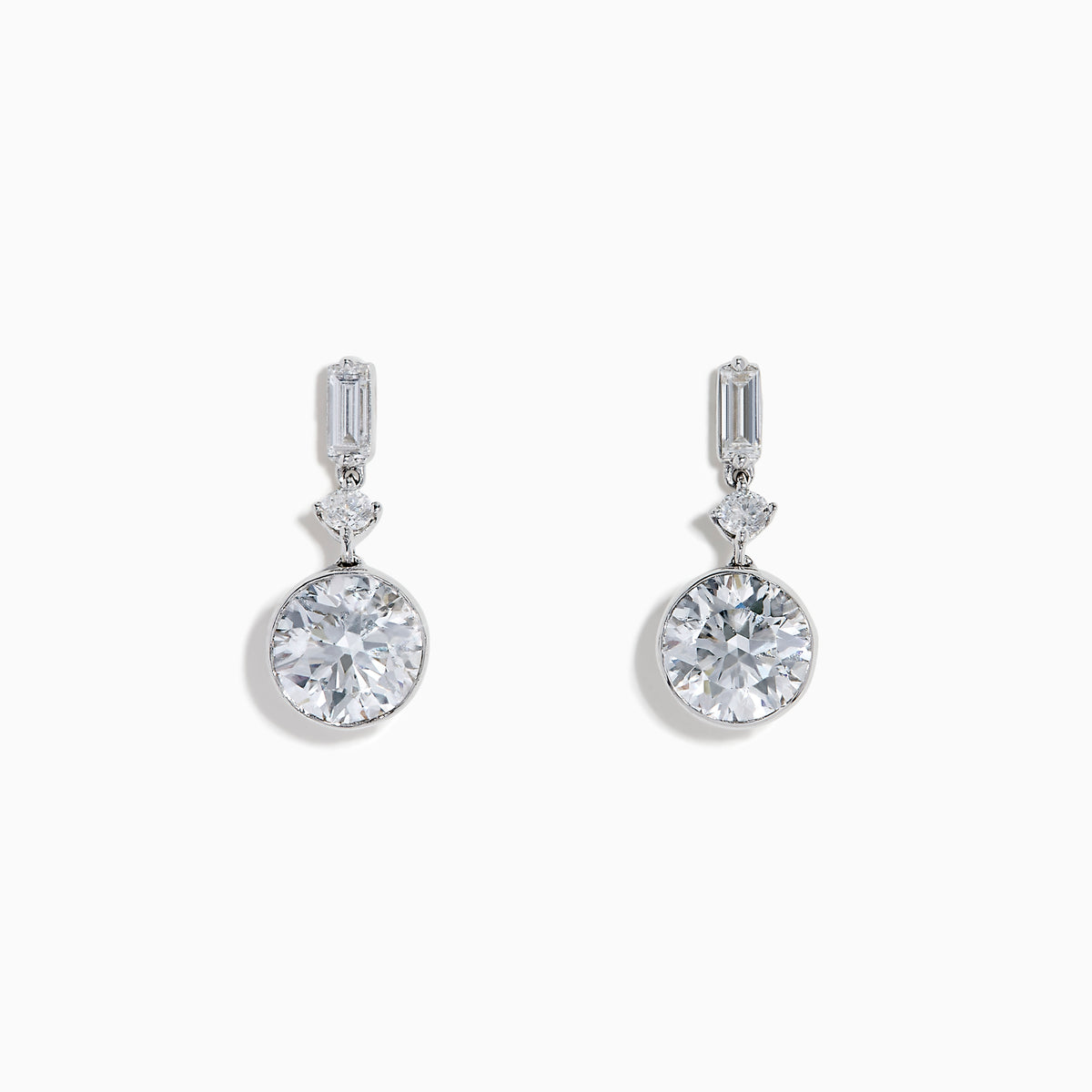 Star Lab Grown Diamond Bezel Solitaire Drop Earrings in 18K White Gold feature a round diamond at the bottom, a marquise-shaped diamond in the middle, and a rectangular diamond at the top, all set against a white background.