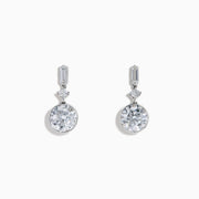 Star Lab Grown Diamond Bezel Solitaire Drop Earrings in 18K White Gold feature a round diamond at the bottom, a marquise-shaped diamond in the middle, and a rectangular diamond at the top, all set against a white background.