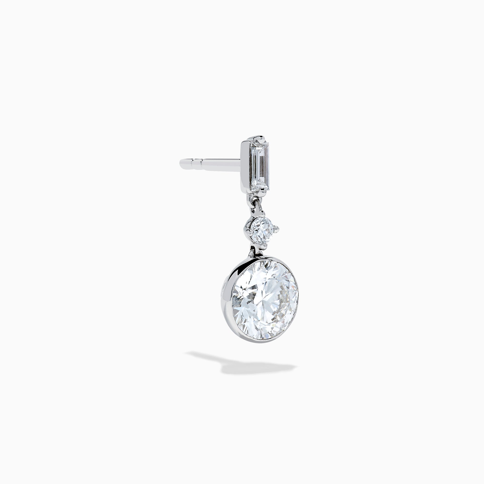 Star Lab Grown Diamond Bezel Solitaire Drop Earrings in 18K White Gold feature a round diamond at the bottom, a marquise-shaped diamond in the middle, and a rectangular diamond at the top, all set against a white background.