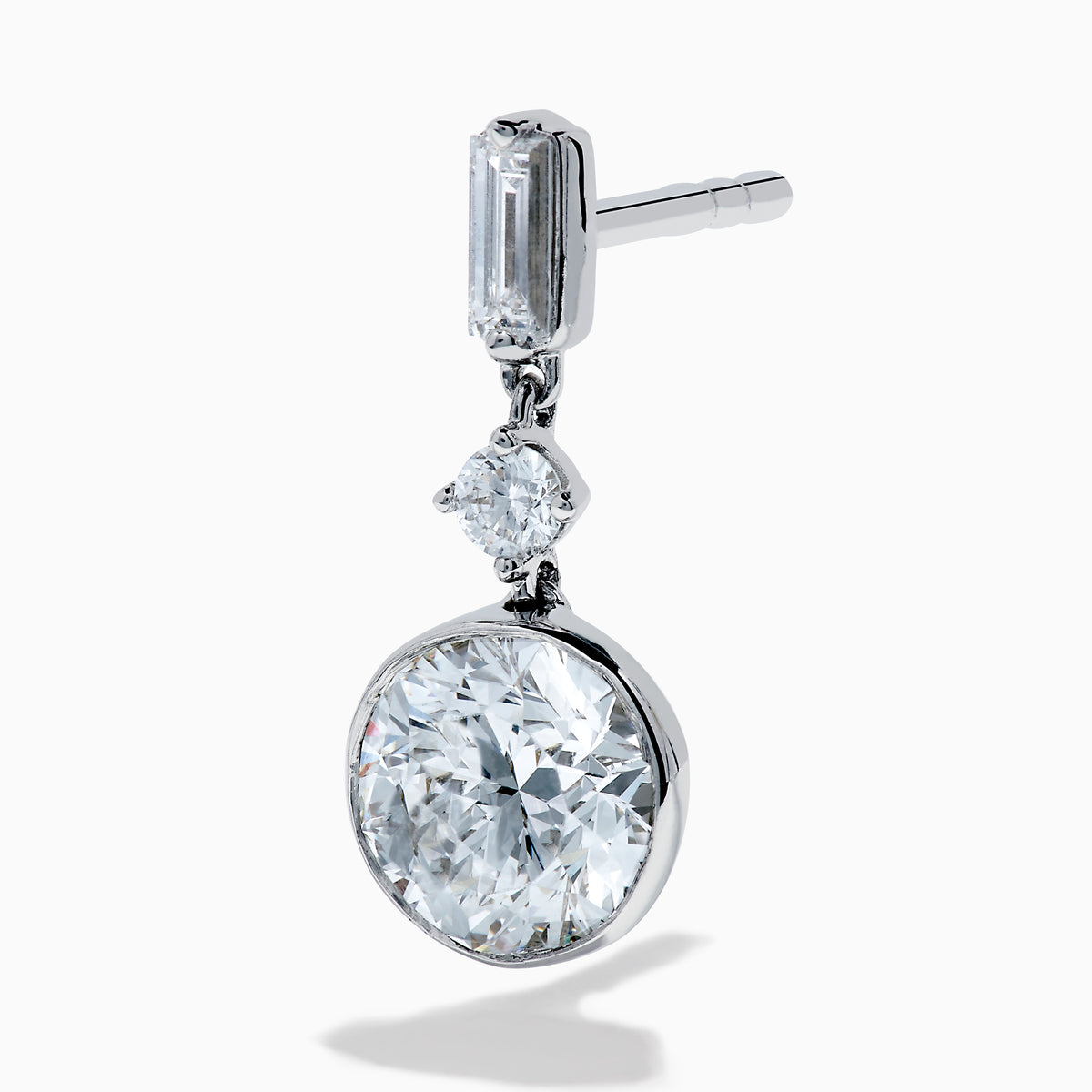 Star Lab Grown Diamond Bezel Solitaire Drop Earrings in 18K White Gold feature a round diamond at the bottom, a marquise-shaped diamond in the middle, and a rectangular diamond at the top, all set against a white background.