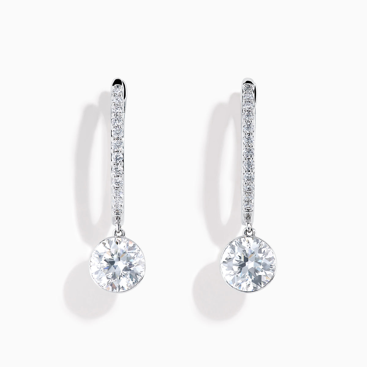 Star Lab Grown Diamond Pave Hoop Solitaire Earrings in 18K White Gold, featuring pavé-set diamonds along the hoop and a large round solitaire gem at the end, displayed on a white background.