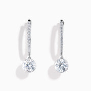 Star Lab Grown Diamond Pave Hoop Solitaire Earrings in 18K White Gold, featuring pavé-set diamonds along the hoop and a large round solitaire gem at the end, displayed on a white background.