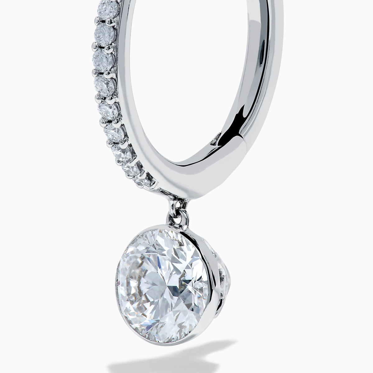 Star Lab Grown Diamond Pave Hoop Solitaire Earrings in 18K White Gold, featuring pavé-set diamonds along the hoop and a large round solitaire gem at the end, displayed on a white background.