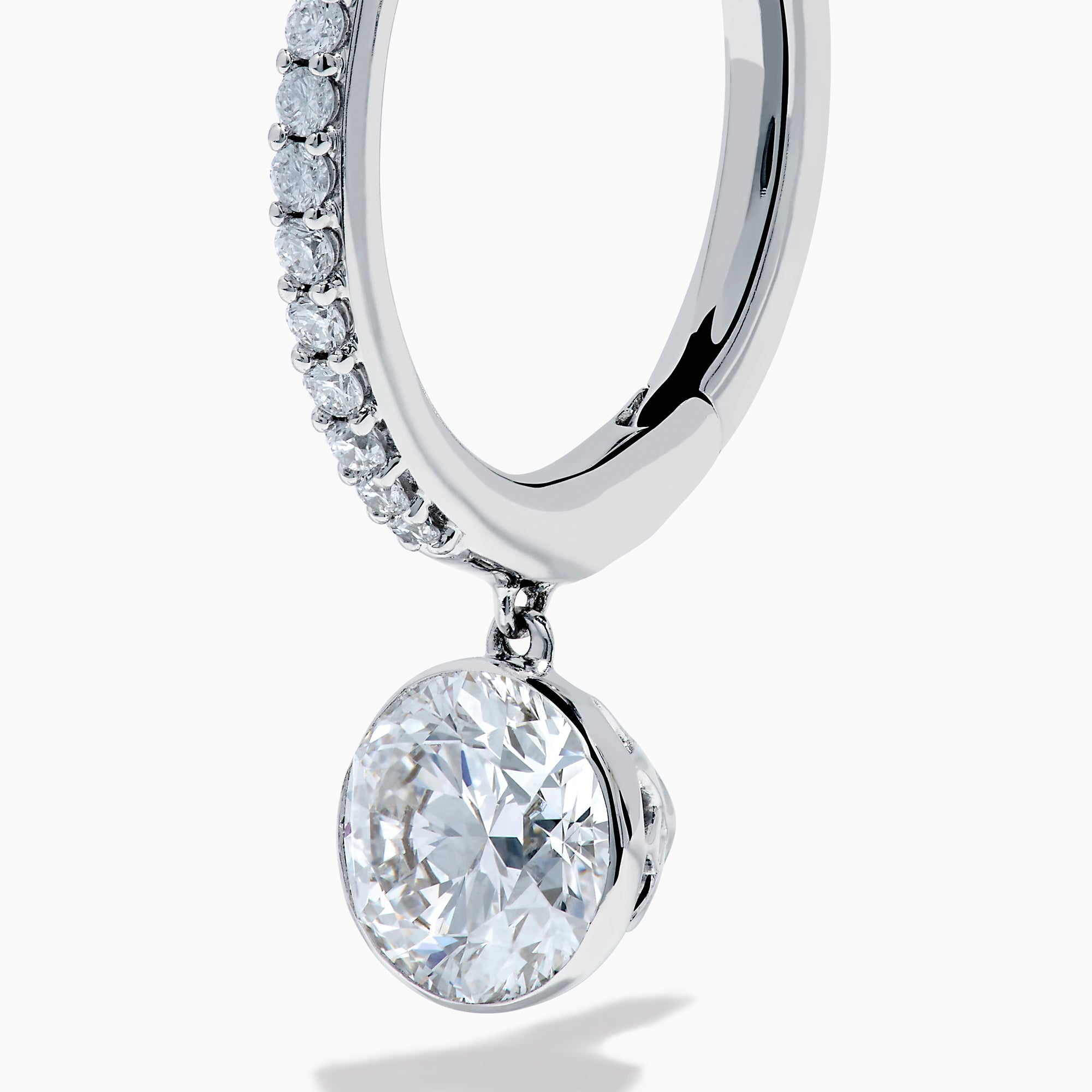 Star Lab Grown Diamond Pave Hoop Solitaire Earrings in 18K White Gold, featuring pavé-set diamonds along the hoop and a large round solitaire gem at the end, displayed on a white background.