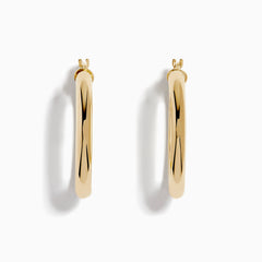 A pair of 14K Yellow Gold Hollow Round Hoop Earrings is shown on a white background, with soft shadows cast to the left.