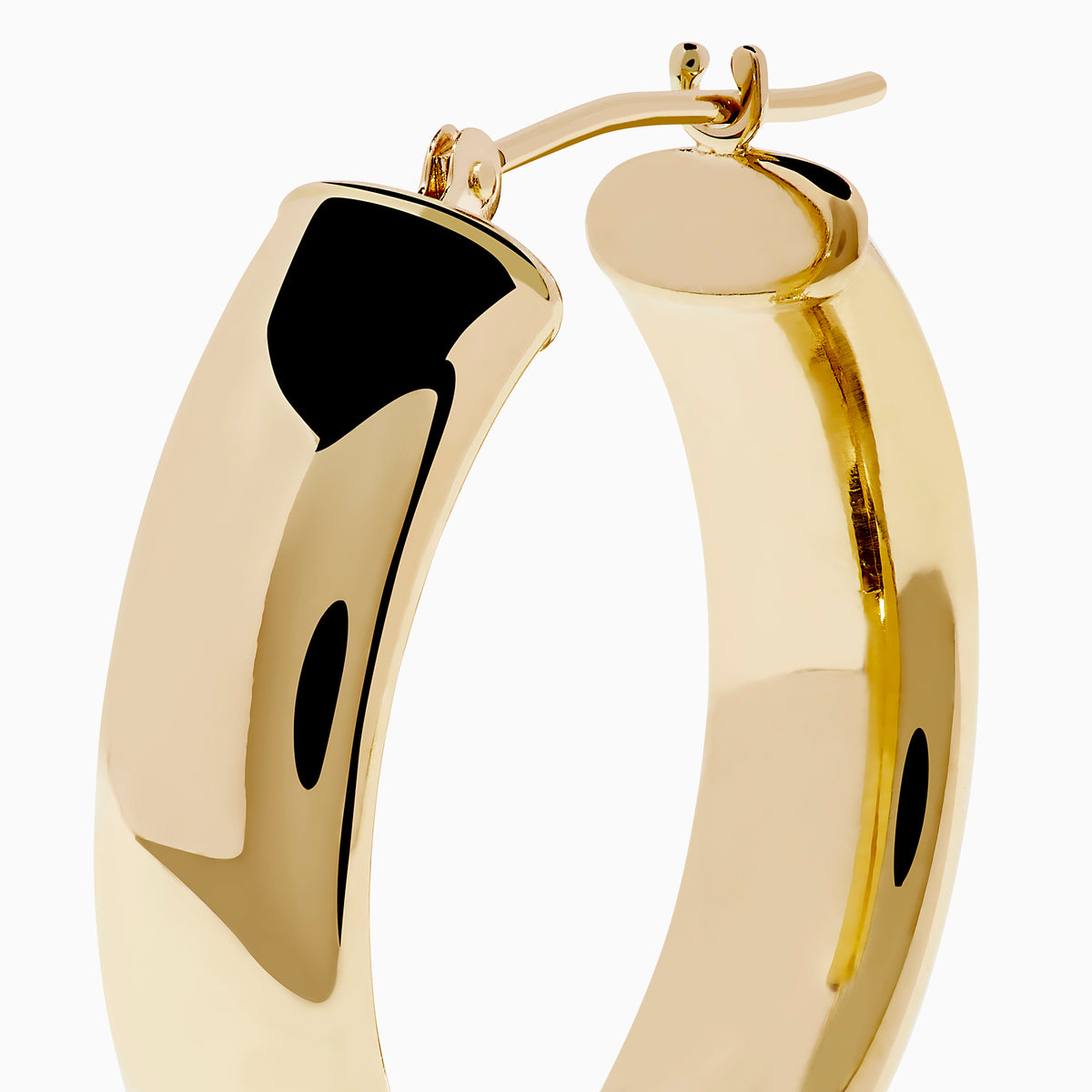 A pair of 14K Yellow Gold Hoops with a smooth, rounded surface shines brightly, displayed vertically against a plain white background.