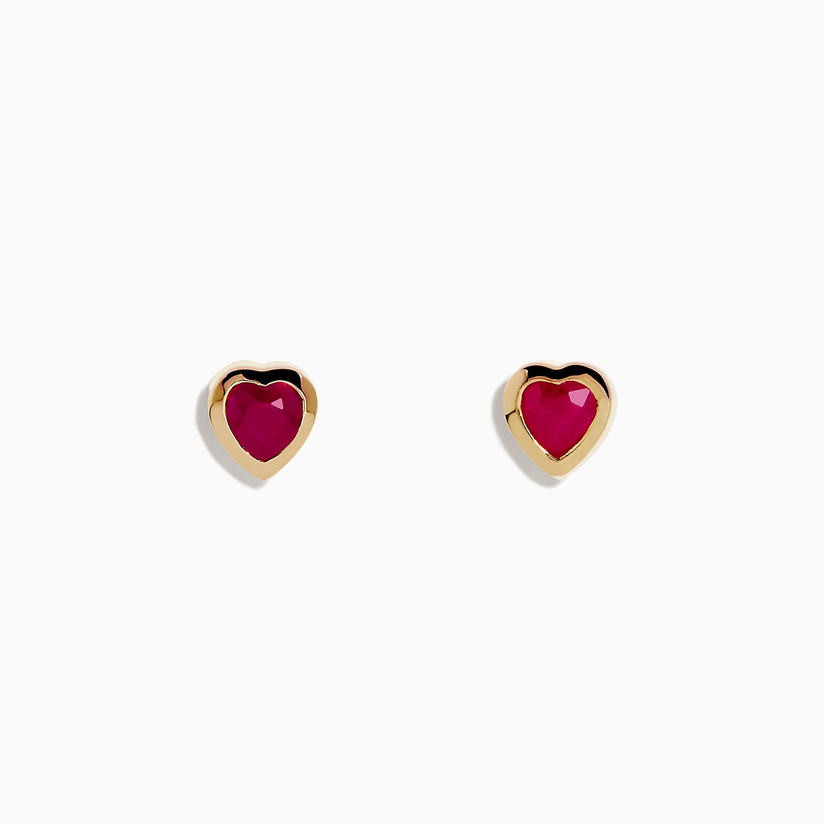 14K Yellow Gold Ruby Heart Earrings feature heart-shaped deep pink rubies set in the center, displayed on a white background—stylish and perfect for any occasion.