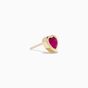 14K Yellow Gold Ruby Heart Earrings feature heart-shaped deep pink rubies set in the center, displayed on a white background—stylish and perfect for any occasion.