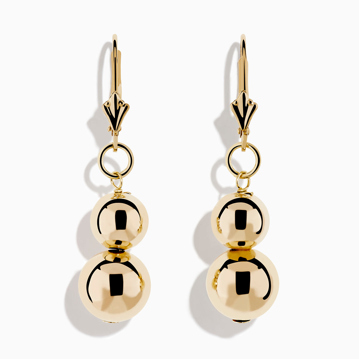 The 14K Yellow Gold Bead Dangle Earrings feature two stacked shiny gold spheres on each earring, suspended from gold hooks with a decorative top detail, shown against a plain white background.