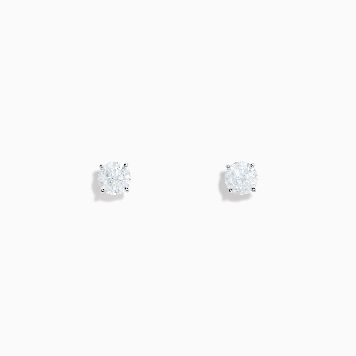 The 14K White Gold Diamond Solitaire Stud Earrings, 0.75 TCW, feature small round diamonds in silver prongs and are shown on a plain white background.