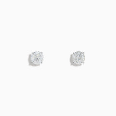 The 14K White Gold 1.18ct Brilliant Round Diamond Solitaire Stud Earrings feature sparkling diamonds in classic prong settings, showcased on a simple white background.