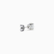 The 14K White Gold 1.18ct Brilliant Round Diamond Solitaire Stud Earrings feature sparkling diamonds in classic prong settings, showcased on a simple white background.