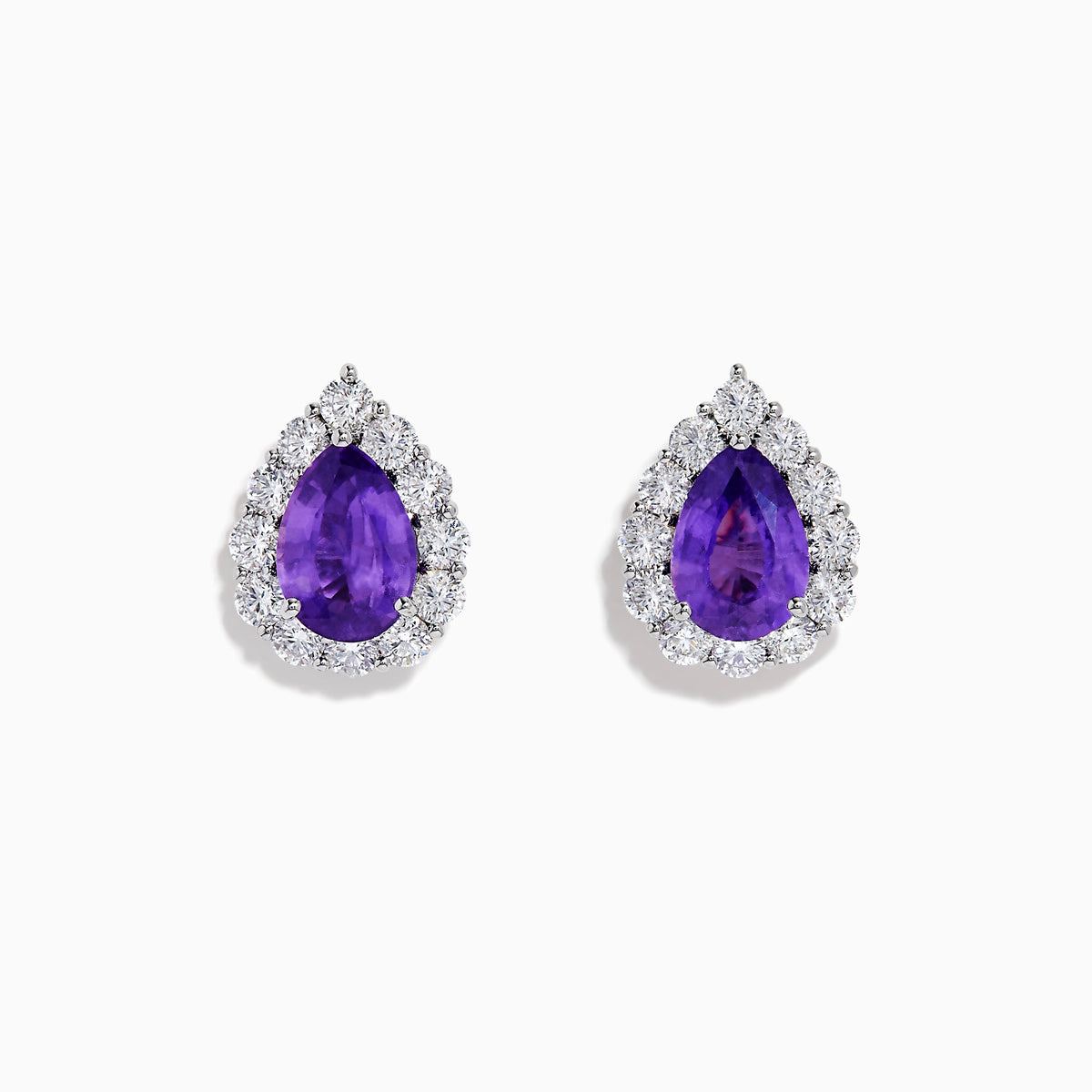 The 18K White Gold Purple Sapphire and Diamond Halo Earrings showcase teardrop-shaped purple sapphires encircled by sparkling diamonds, set against a white background.