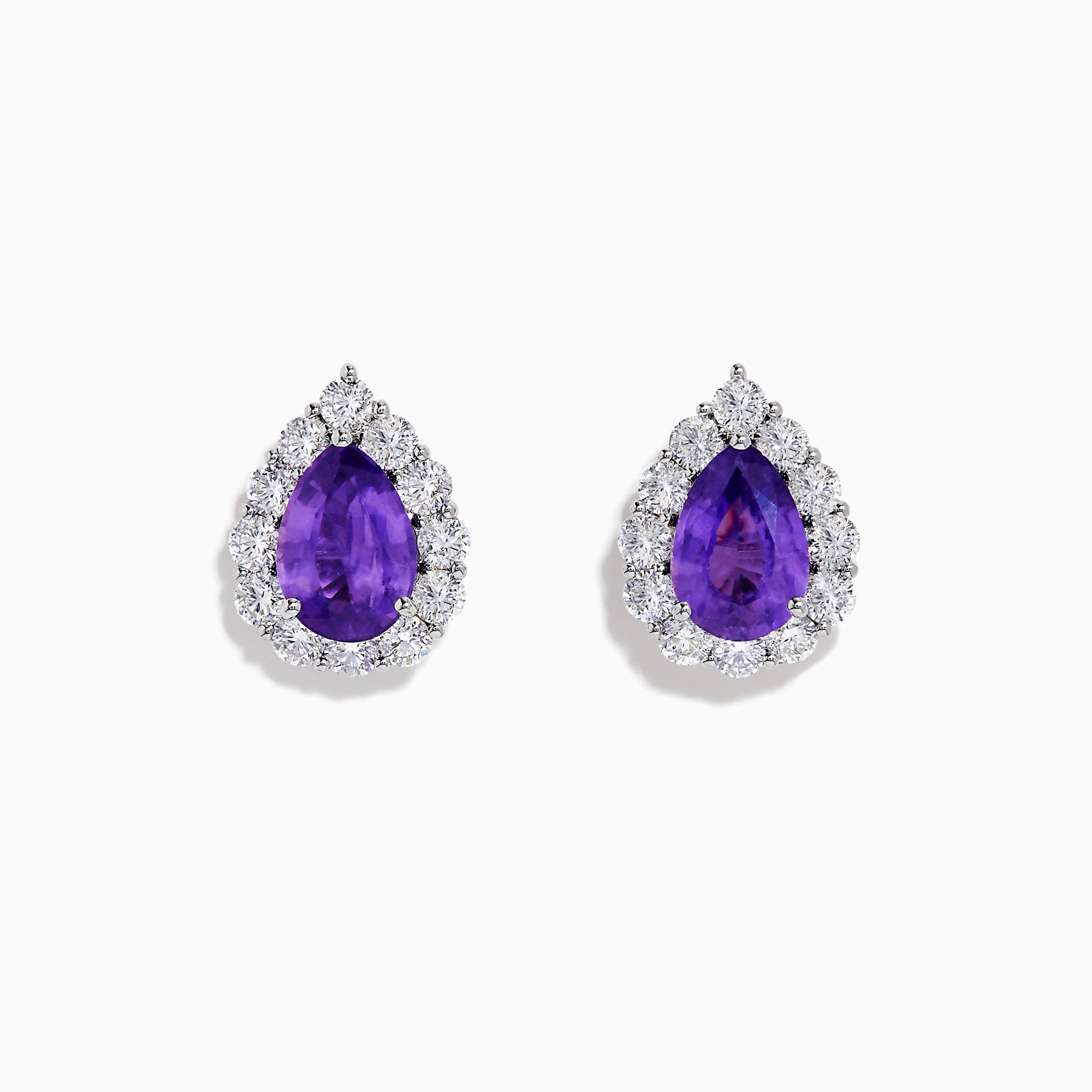 The 18K White Gold Purple Sapphire and Diamond Halo Earrings showcase teardrop-shaped purple sapphires encircled by sparkling diamonds, set against a white background.