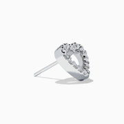 The 18K White Gold Diamond Heart Stud Earrings feature open-centered hearts outlined with sparkling diamonds, shown against a white background.