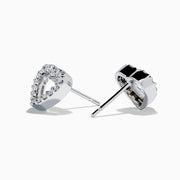The 18K White Gold Diamond Heart Stud Earrings feature open-centered hearts outlined with sparkling diamonds, shown against a white background.