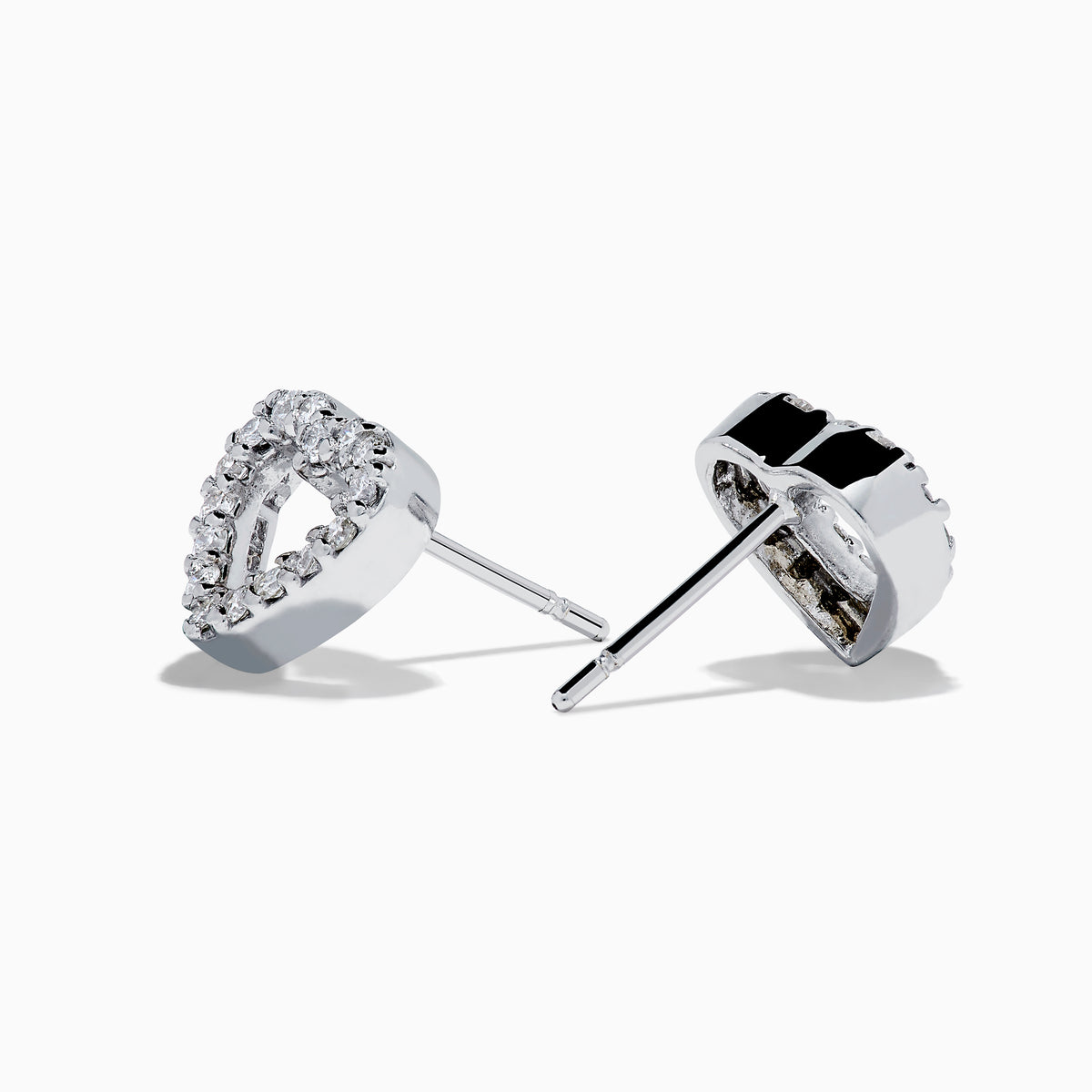 The 18K White Gold Diamond Heart Stud Earrings feature open-centered hearts outlined with sparkling diamonds, shown against a white background.