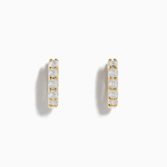 DOro 14 Karat Yellow Gold 5/8 Diamond Hoop Earrings with a total carat weight of 0.98, each set with five sparkling diamonds, displayed against a white background.