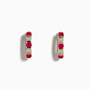 The Ruby Royale 14K Yellow Gold Ruby and Diamond 5/8 Hoop Earrings feature alternating round rubies and diamonds, displayed vertically against a white background.