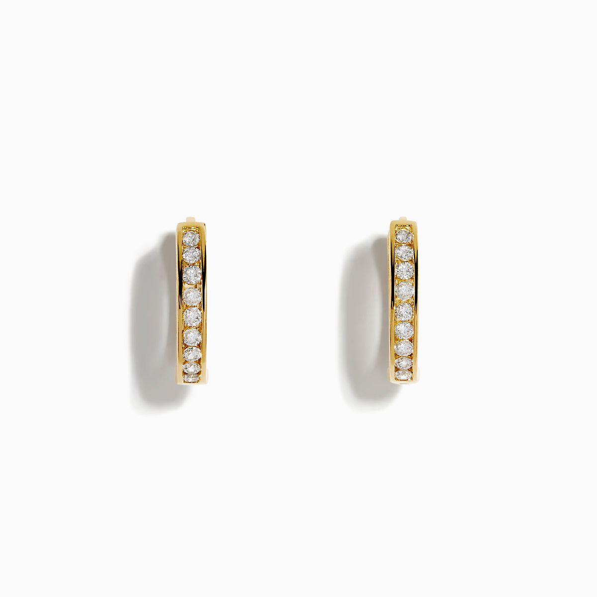 The 14K Yellow Gold Channel Set Diamond Mini Hoop Earrings feature a row of sparkling round diamonds, elegantly displayed on a white background.