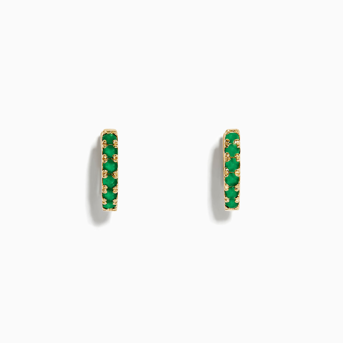 A pair of Brasilica 14K Yellow Gold Emerald Huggie Earrings is displayed against a plain white background.
