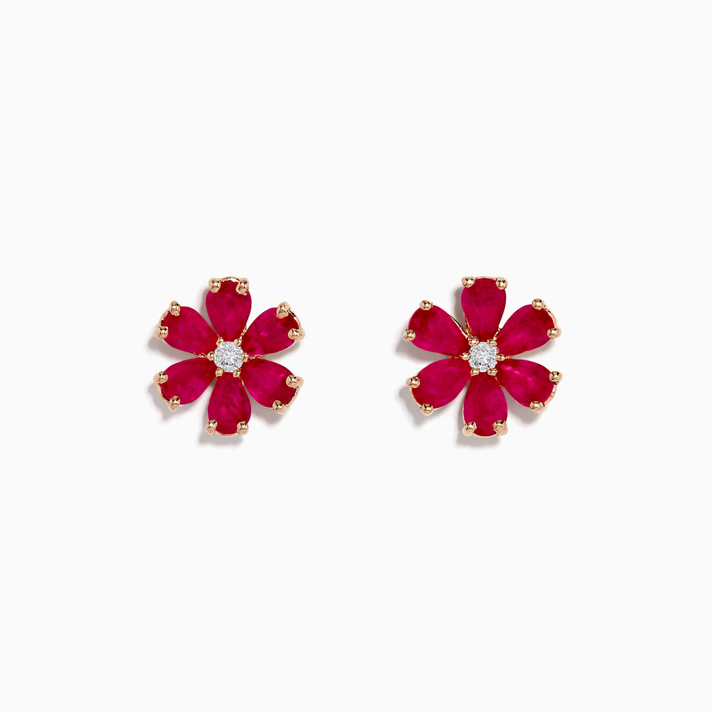The 14K Rose Gold Ruby Flower Earrings feature deep pink, ruby-like petals and a clear center gemstone, crafted in 14K rose gold and displayed on a white background.