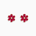 The 14K Rose Gold Ruby Flower Earrings feature deep pink, ruby-like petals and a clear center gemstone, crafted in 14K rose gold and displayed on a white background.