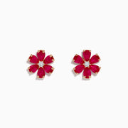The 14K Rose Gold Ruby Flower Earrings feature deep pink, ruby-like petals and a clear center gemstone, crafted in 14K rose gold and displayed on a white background.