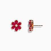 The 14K Rose Gold Ruby Flower Earrings feature deep pink, ruby-like petals and a clear center gemstone, crafted in 14K rose gold and displayed on a white background.
