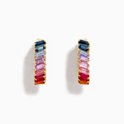 The Watercolors 14K Yellow Gold Multi Sapphire Inside-Out Hoop Earrings feature vertically arranged rectangular sapphires in blue, purple, pink, and red gradients on a white background.