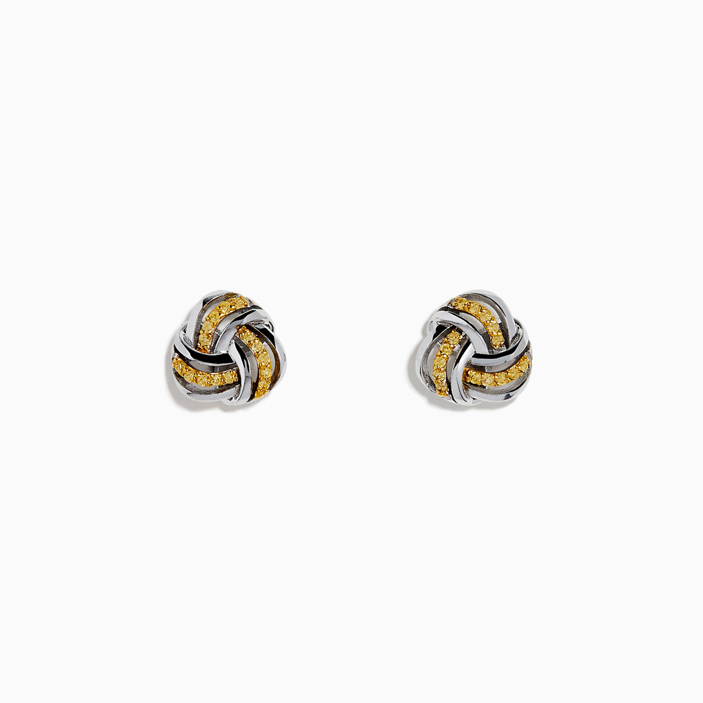 The 14K White Gold Yellow Diamond Love Knot Earrings feature an intricate love knot design with polished and textured finishes, crafted in 14K white gold, and are shown on a plain white background.