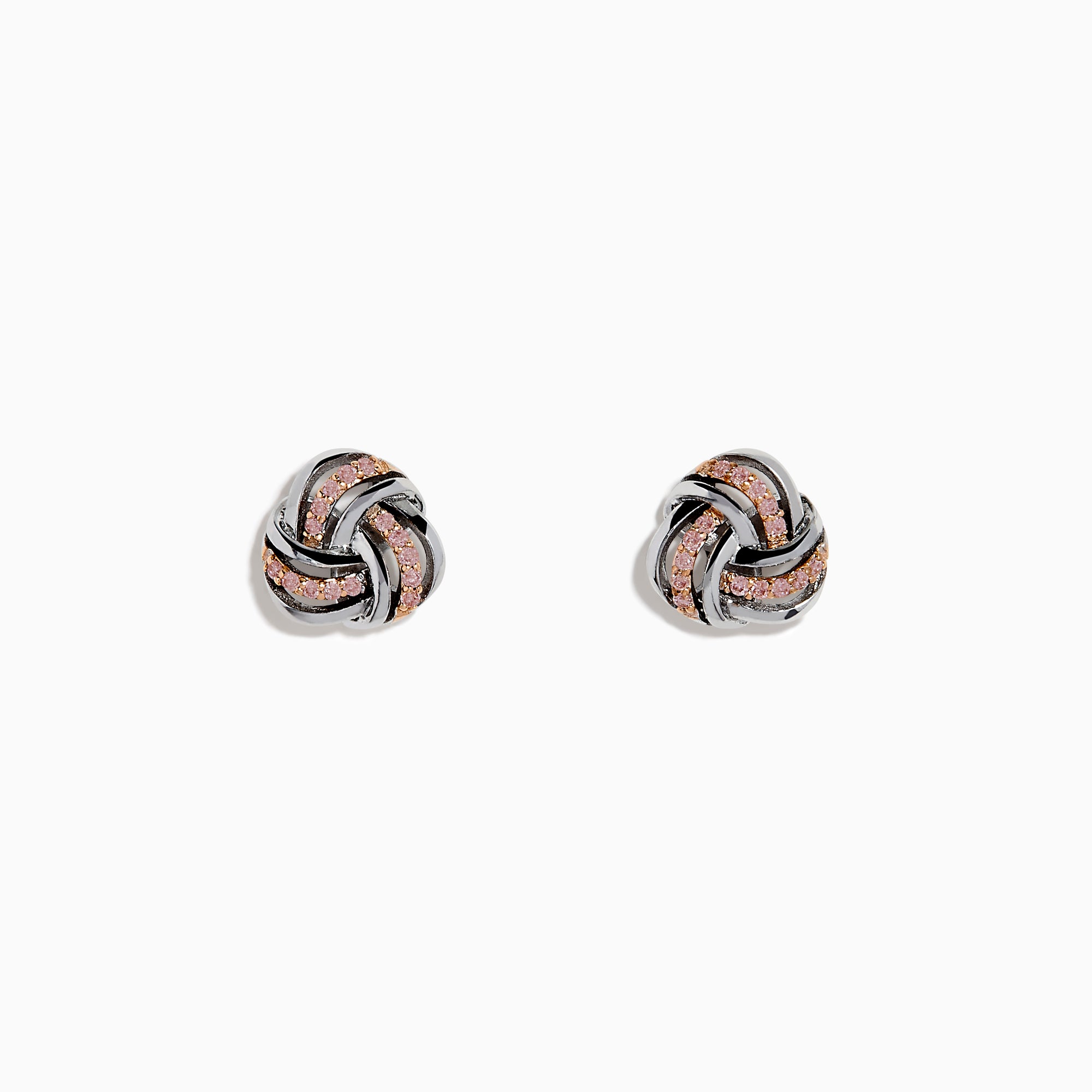 The 14K White Gold Pink Diamond Love Knot Earrings feature an intricate knot design in silver and rose gold tones, accented with sparkling pink diamonds. They are displayed against a plain white background.