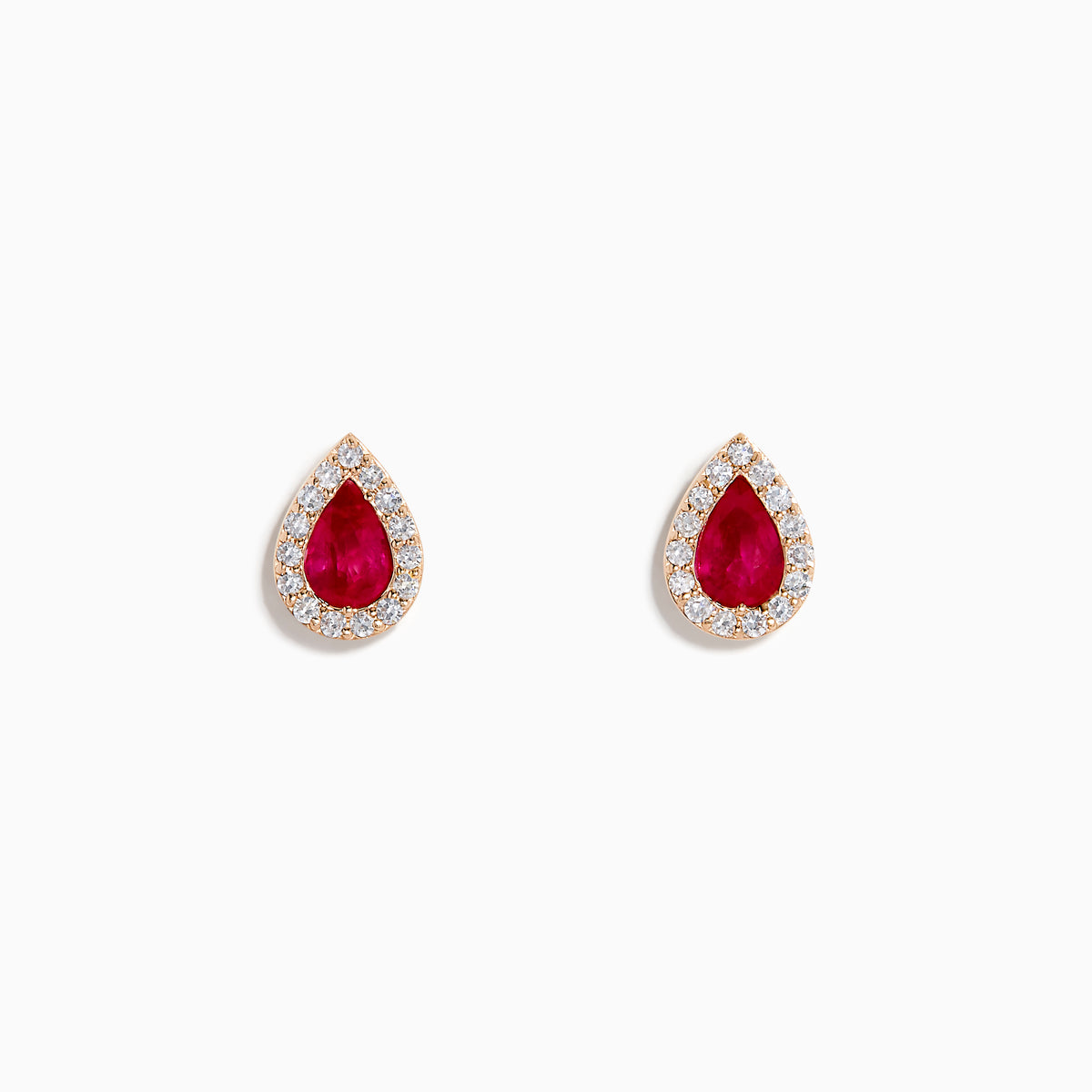 A pair of 14K rose gold ruby and diamond pear halo stud earrings with red rubies framed by diamonds, shown on a white background.