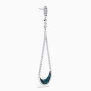 The 14K White Gold Blue and White Diamond Drop Earrings feature teardrop loops accented with sparkling white stones and blue stones near the bottom for a timeless, elegant look.