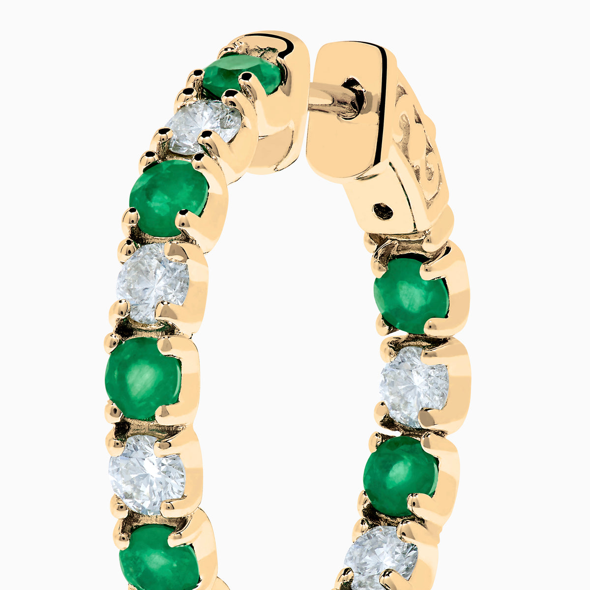 Displayed against a white background, these 14K yellow gold hoop earrings feature alternating emerald and diamond gemstones (3.58 TCW), making for a striking and elegant pair.