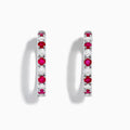 The 14K White Gold Ruby & Diamond Hoop Earrings, 3.58 TCW, feature alternating rubies and diamonds set in white gold hoops, shown on a white background.
