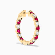 14K Yellow Gold Ruby & Diamond Hoop Earrings, 3.58 TCW, featuring alternating round red rubies and white diamonds, are displayed vertically on a white background.
