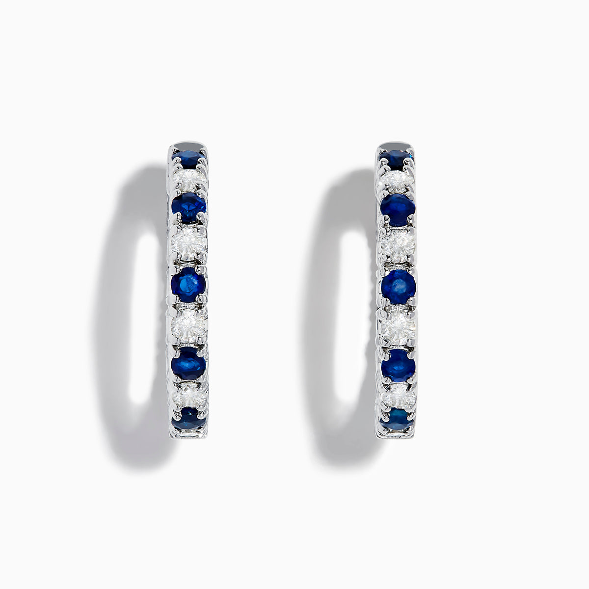 A pair of 14K White Gold Blue Sapphire & Diamond Hoop Earrings, 3.58 TCW, showcased against a plain white background.