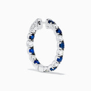 A pair of 14K White Gold Blue Sapphire & Diamond Hoop Earrings, 3.58 TCW, showcased against a plain white background.