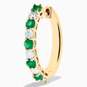 A pair of 14K Yellow Gold Emerald & Diamond Hoop Earrings, 1.35 TCW, featuring alternating round emeralds and diamonds, displayed on a white background.