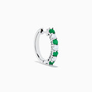 A pair of 14K white gold emerald & diamond hoop earrings, 1.10 TCW, featuring alternating green and clear gemstones set in a silver band, displayed on a white background with soft shadows.
