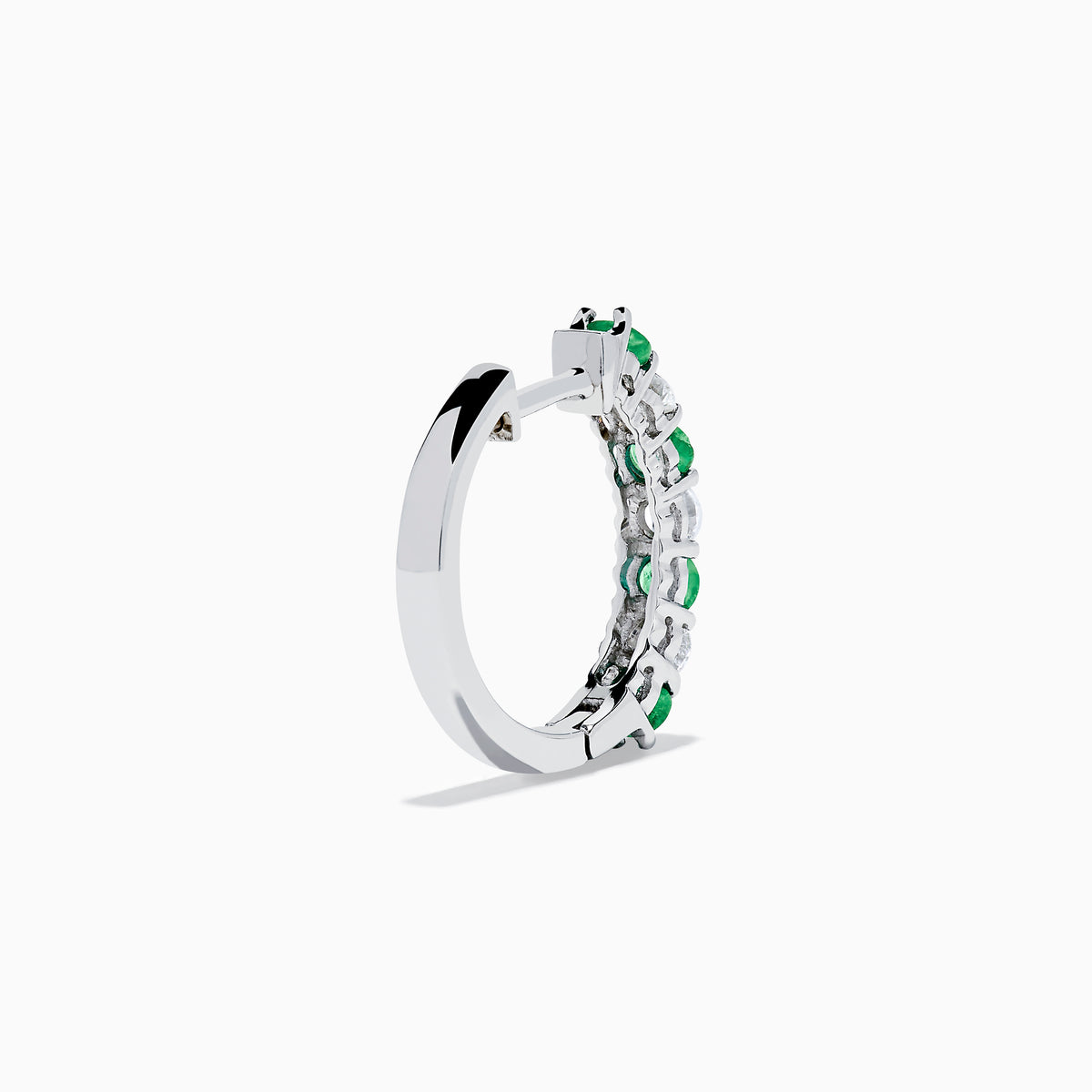 A pair of 14K white gold emerald & diamond hoop earrings, 1.10 TCW, featuring alternating green and clear gemstones set in a silver band, displayed on a white background with soft shadows.