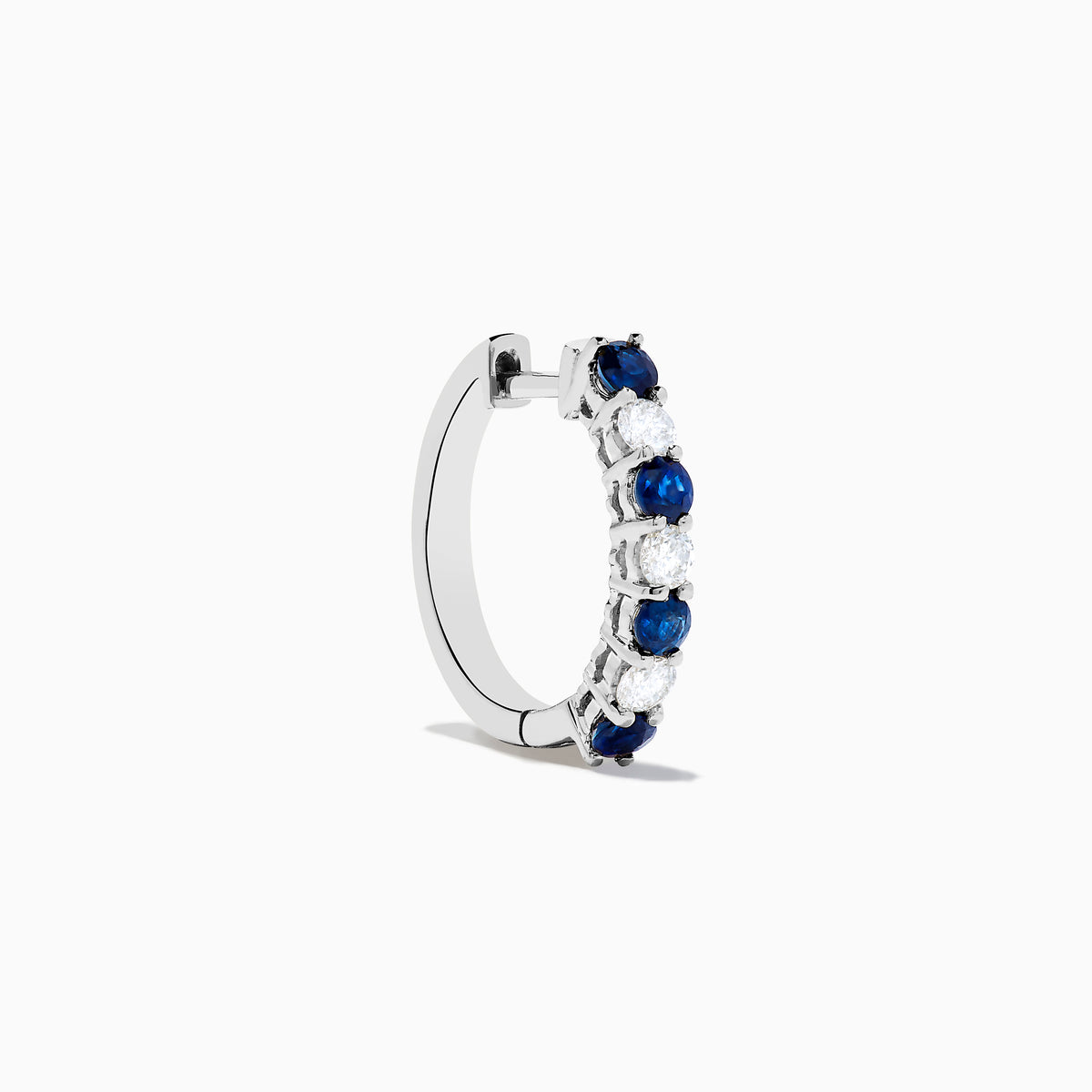 The 14K White Gold Blue Sapphire & Diamond Hoop Earrings, 1.10 TCW, are shown on a plain white background with soft left-side shadows, highlighting alternating sapphire and diamond stones.