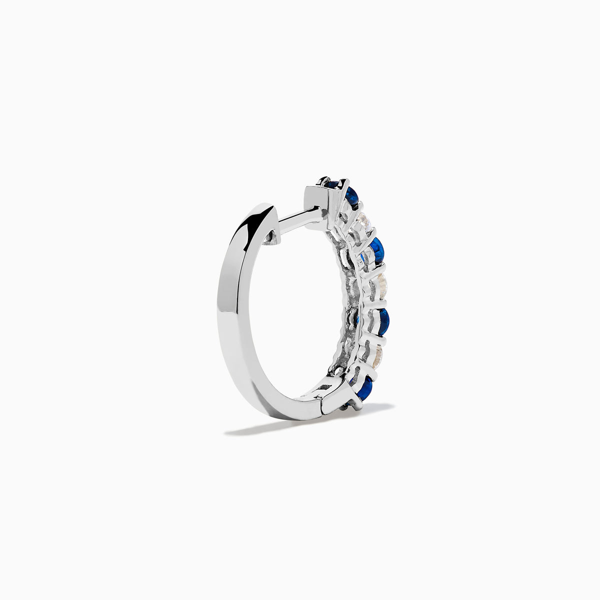 The 14K White Gold Blue Sapphire & Diamond Hoop Earrings, 1.10 TCW, are shown on a plain white background with soft left-side shadows, highlighting alternating sapphire and diamond stones.