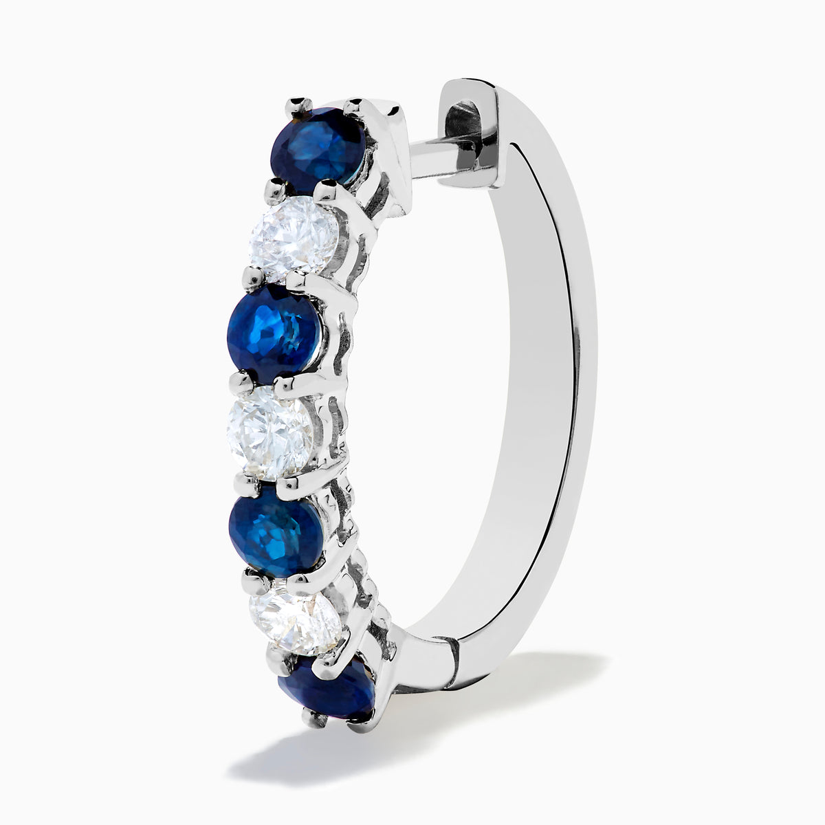 The 14K White Gold Blue Sapphire & Diamond Hoop Earrings, 1.10 TCW, are shown on a plain white background with soft left-side shadows, highlighting alternating sapphire and diamond stones.