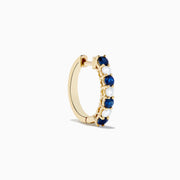 The 14K Yellow Gold Blue Sapphire & Diamond Hoop Earrings, 1.10 TCW, feature alternating sapphires and diamonds in a classic hoop design, shown on a plain white background with visible shadows.